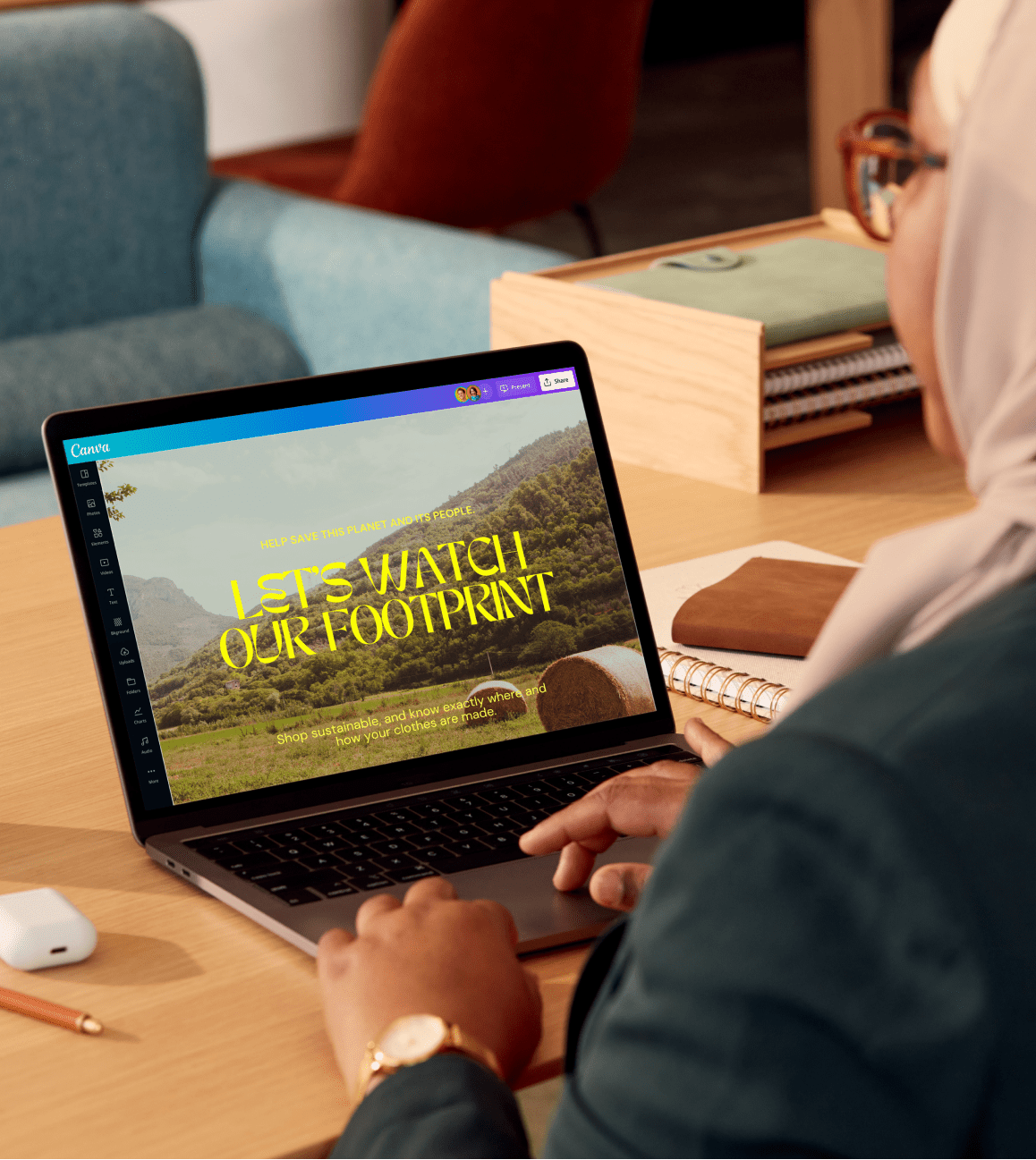 A person using Canva with their laptop